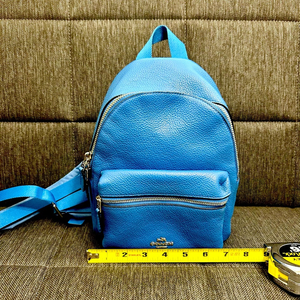 Fun, blue Coach mini backpack.